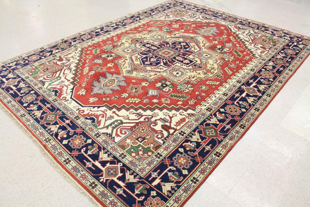 Appraisal: HAND KNOTTED ORIENTAL CARPET Persian Serapi or Heriz design centering