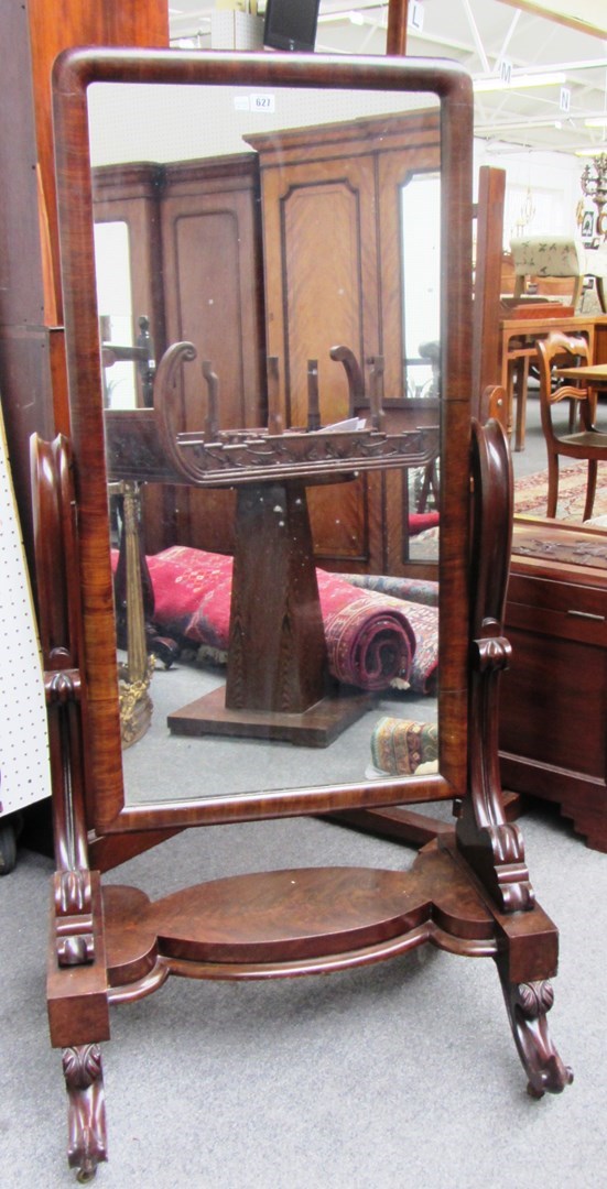 Appraisal: A mid th century mahogany cheval mirror with a pair