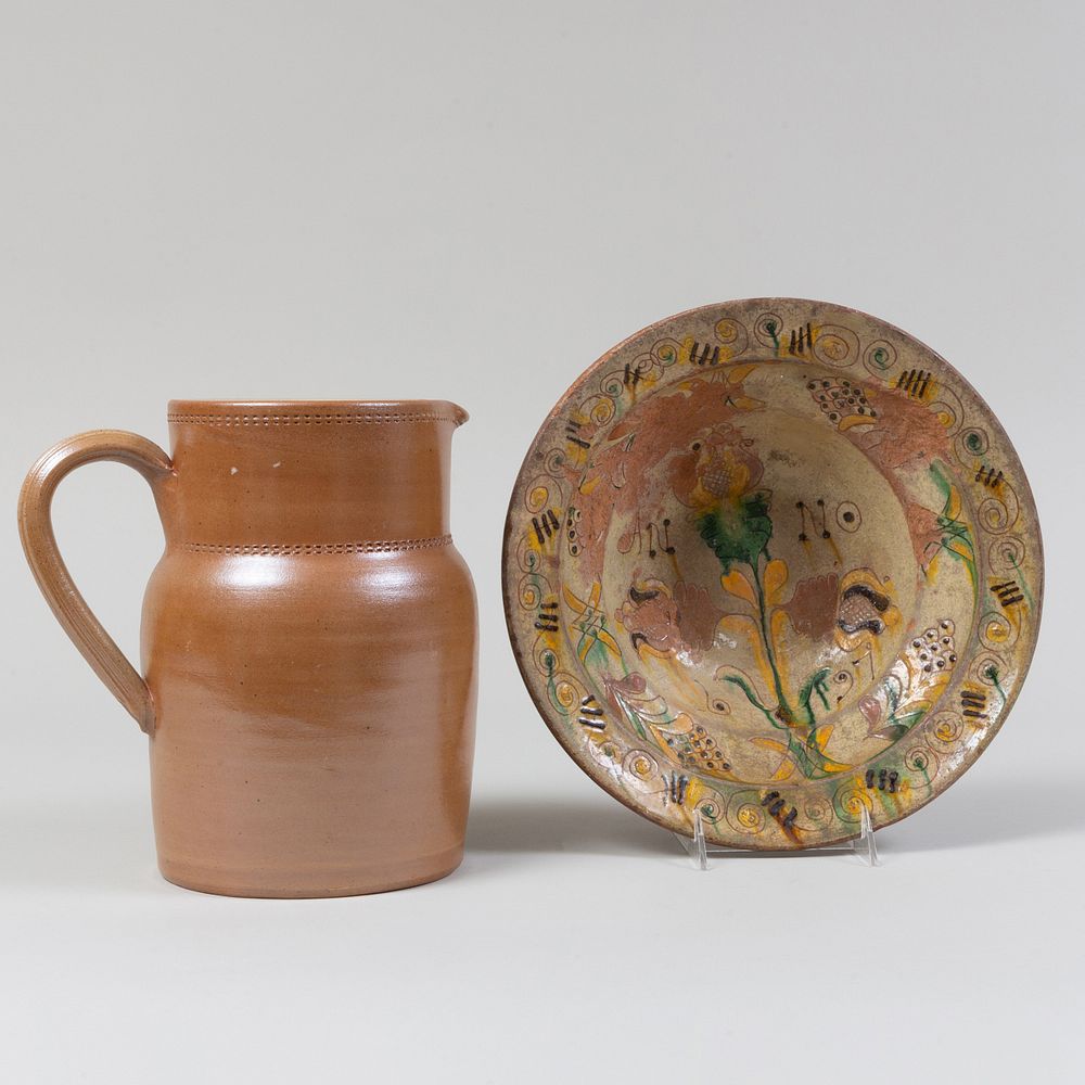 Appraisal: Folk Art Glazed Redware Bowl and French Earthenware Pitcher The