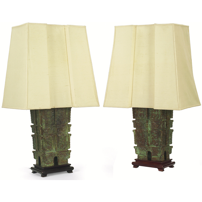 Appraisal: Asian bronze lamps pair heavy solid bronze forms with patina