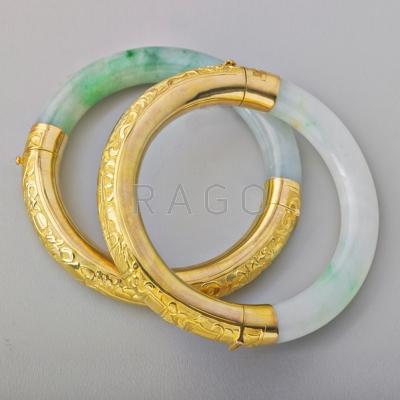 Appraisal: TWO CHISELED GOLD JADE HINGED BANGLES k gold chased with