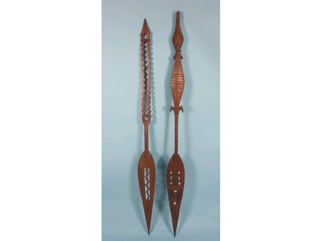 Appraisal: Two carved teak paddles probably Indian each with pierced blade