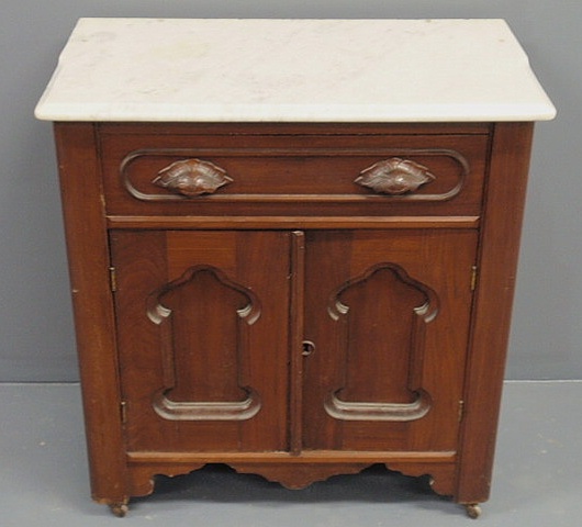 Appraisal: Victorian walnut washstand with marble top h x w x