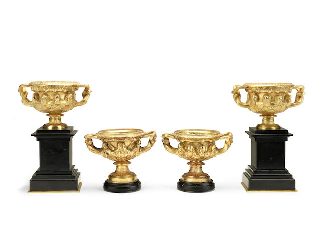 Appraisal: A pair of gilt bronze Warwick garniture vases on low