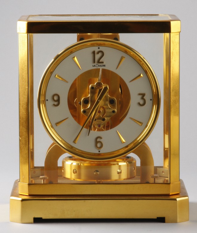 Appraisal: Clock encased in glass with brass mounting t x w