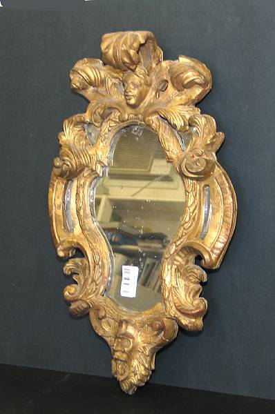 Appraisal: An Italian Baroque style giltwood mirror th century height in