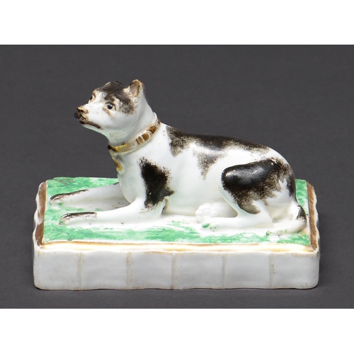 Appraisal: A Rockingham model of a recumbent dog c - sponged