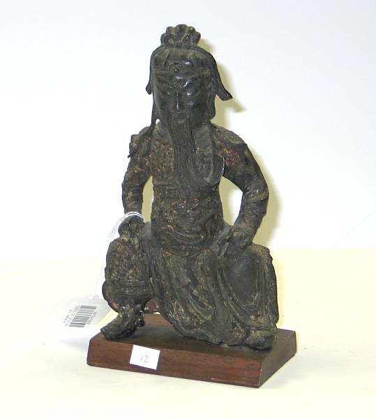 Appraisal: A cast bronze seated figure of Guanyu The martial deity