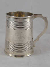 Appraisal: A Victorian silver mug with ribbed banding by the Lias