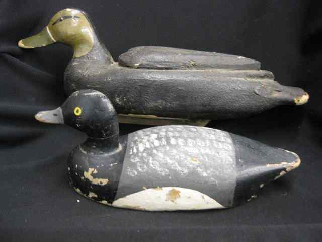 Appraisal: Two Carved Painted Wood Decoys on oversized Herter's black duck