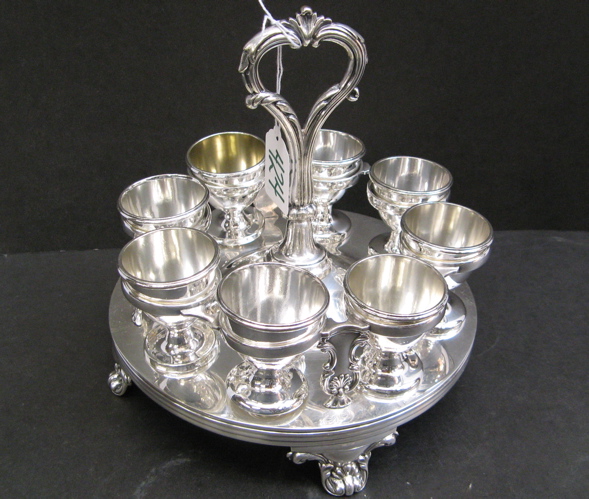 Appraisal: ENGLISH SILVER PLATED EGG CADDY holding egg cups on a