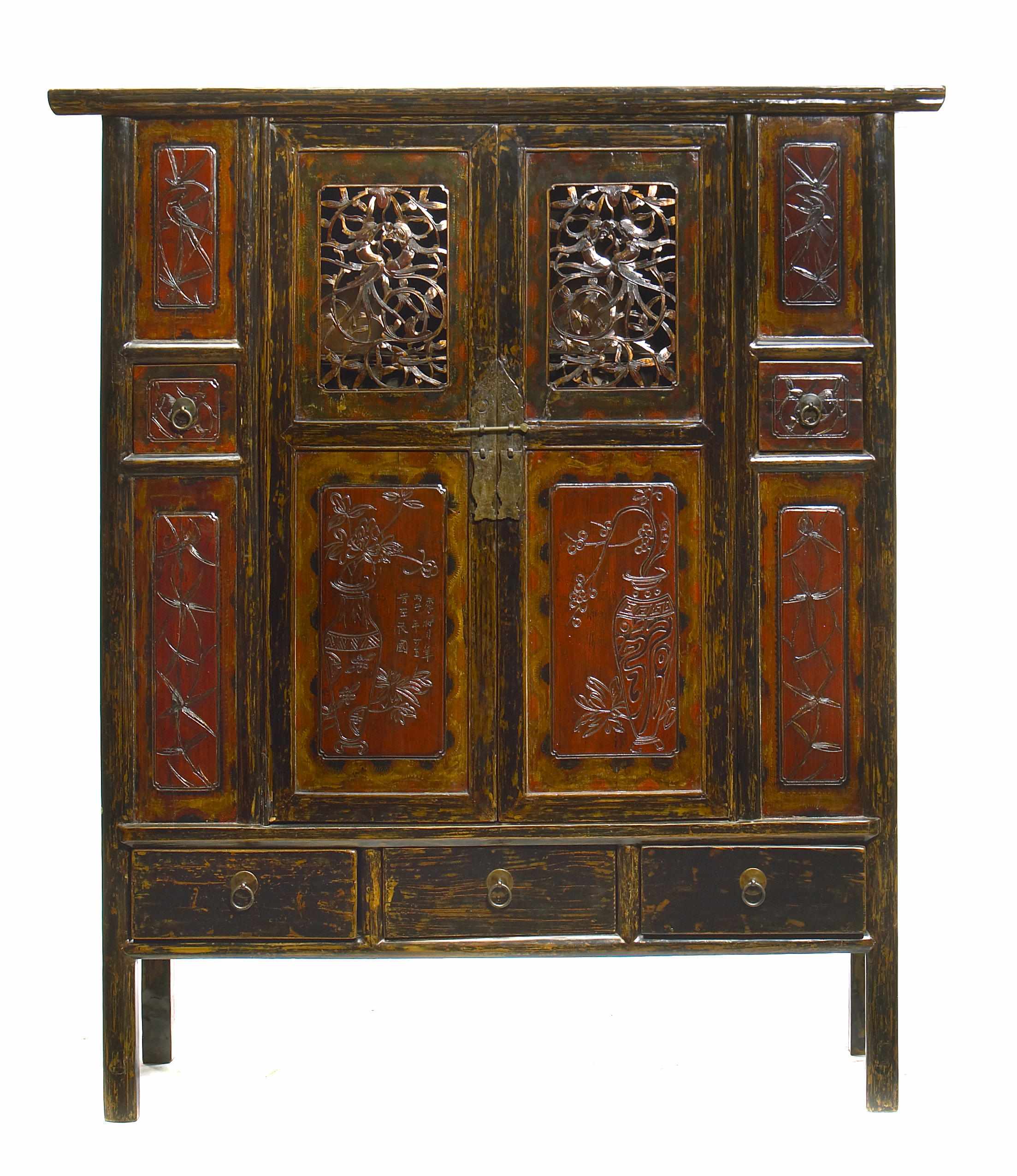 Appraisal: A Chinese carved and lacquered kitchen cabinet height in width