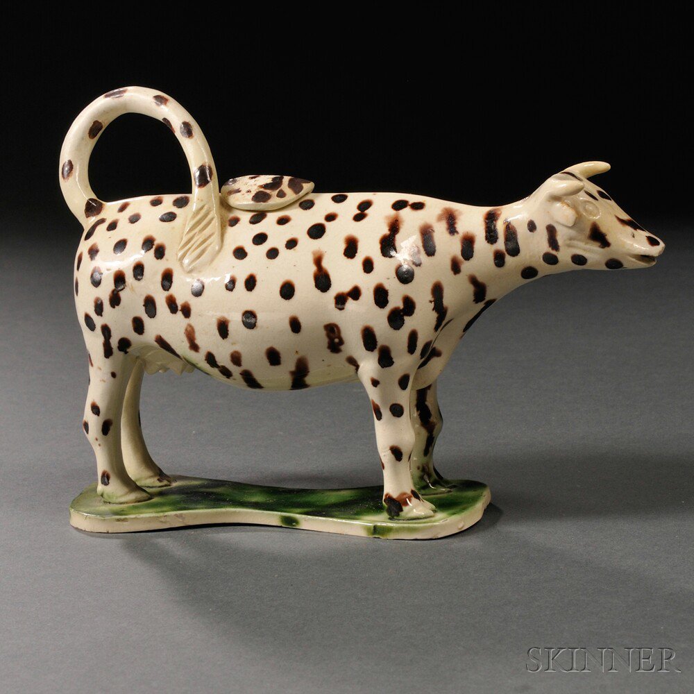 Appraisal: Staffordshire Cream-colored Earthenware Cow Creamer England c speckled brown body