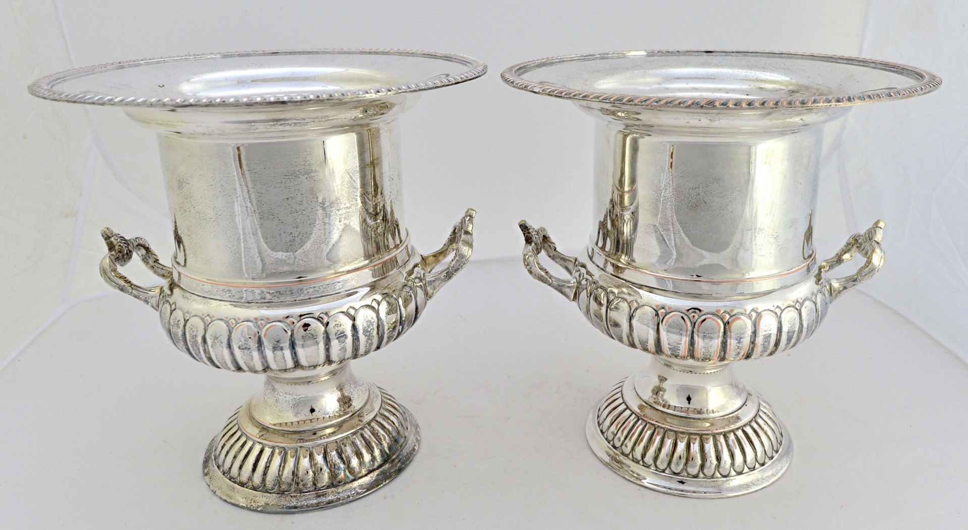 Appraisal: A pair of plated on copper twin handled wine coolers