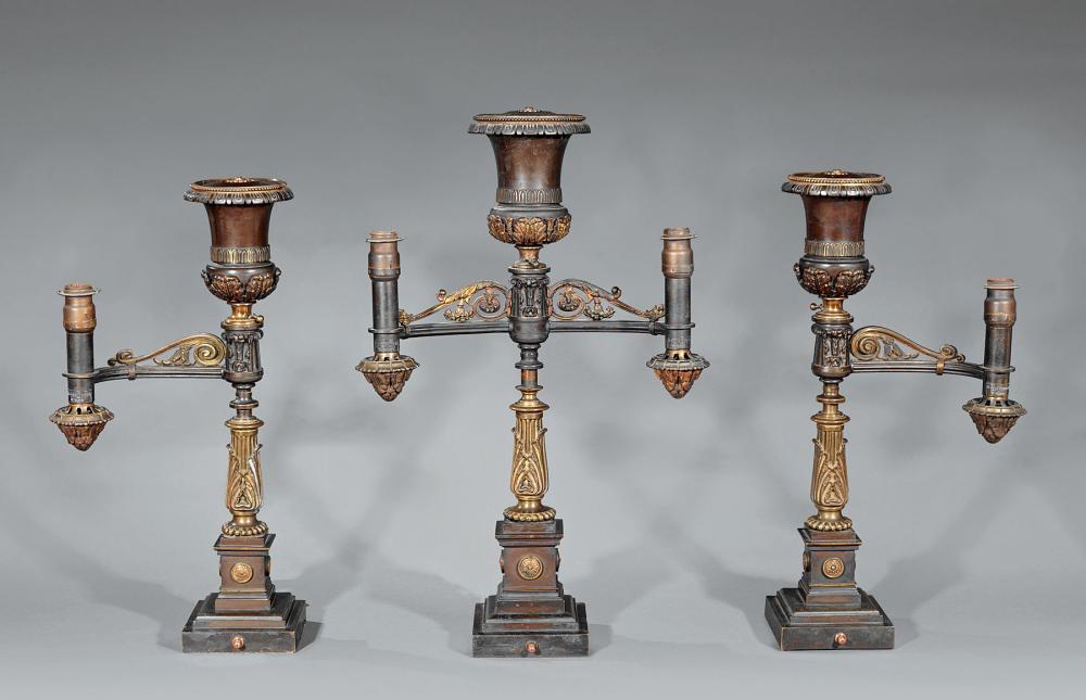 Appraisal: American Gilt and Patinated Bronze Three-Piece Argand Lamp Garniture th