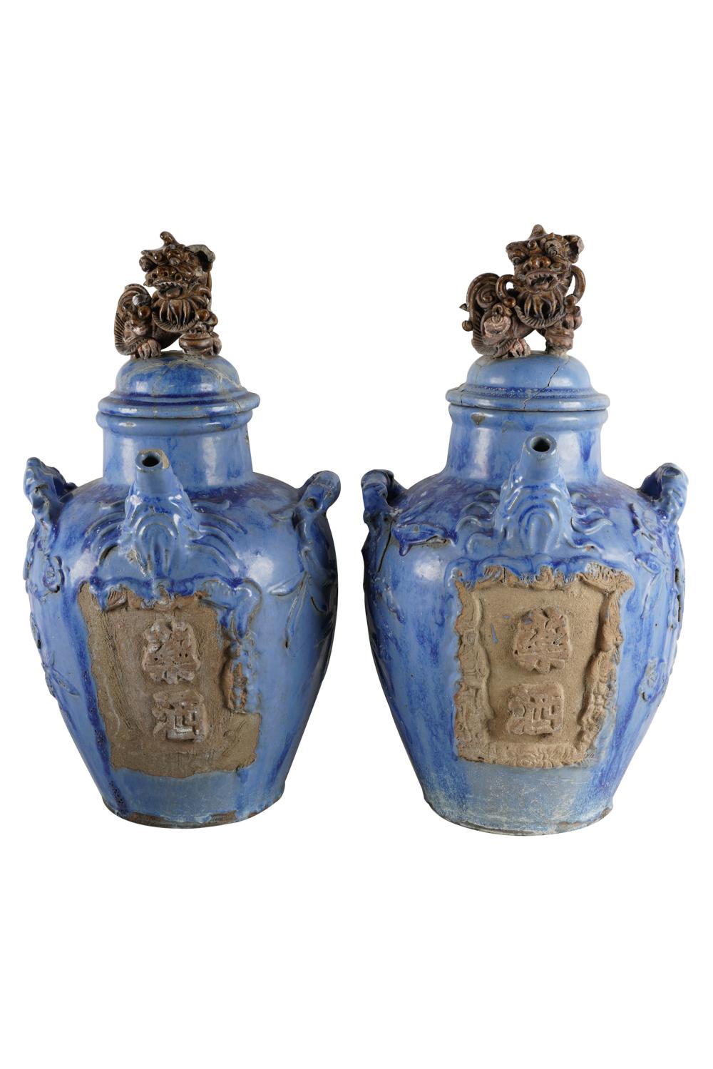 Appraisal: PAIR OF CHINESE BLUE-GLAZED CERAMIC COVERED JARSCondition each lid with