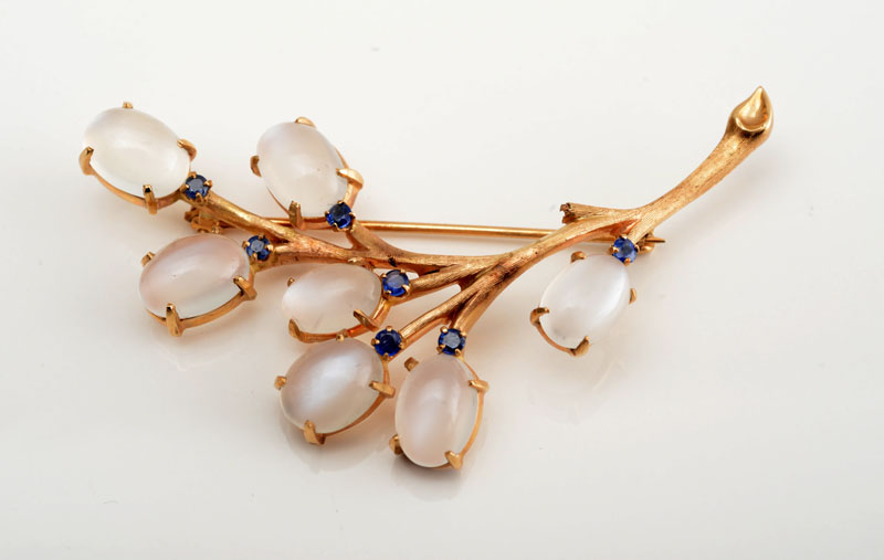 Appraisal: RETRO K GOLD MOONSTONE AND SAPPHIRE PUSSYWILLOW PIN Stamped '