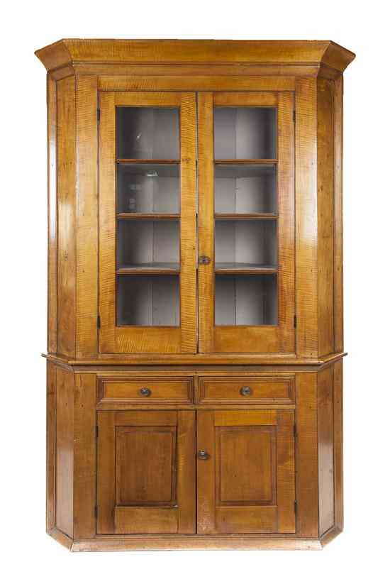 Appraisal: An American Tiger Maple Corner Cabinet having a flared cornice