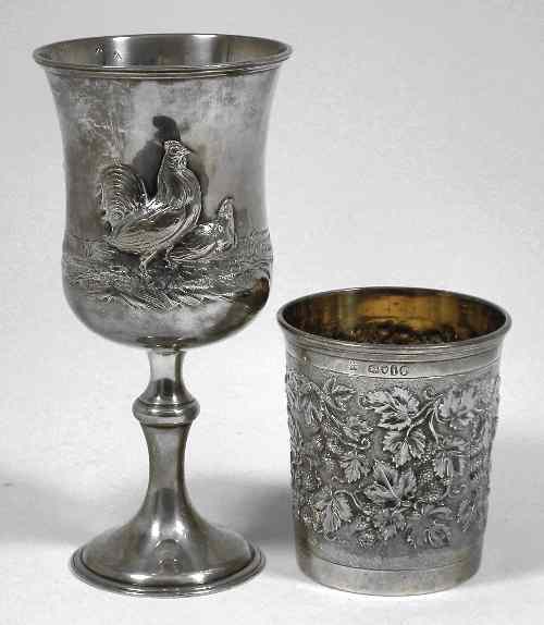 Appraisal: A Victorian silver beaker with moulded rim the sides embossed