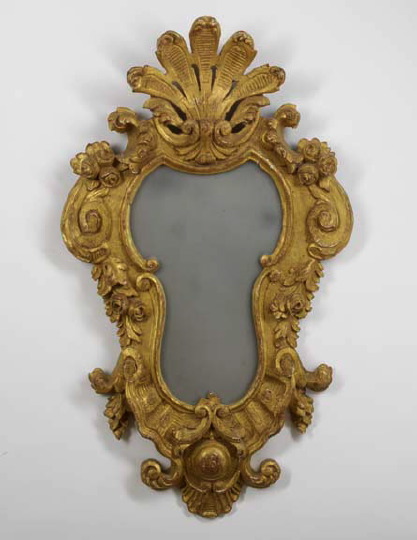 Appraisal: Italian Giltwood Looking Glass mid- th century the shaped plate