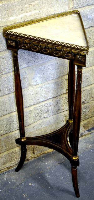 Appraisal: An early th century French gilt mounted marble top mahogany