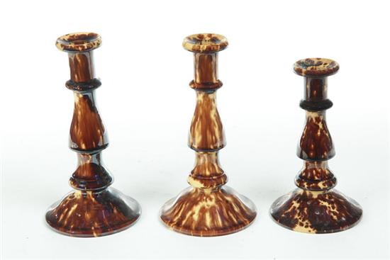 Appraisal: THREE BENNINGTON CANDLESTICKS Vermont mid th century Pair ''h and