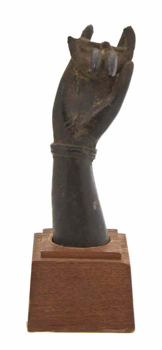 Appraisal: A Southeast Asian Bronze Model of a Hand th th