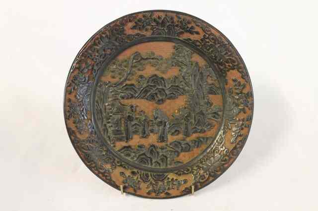 Appraisal: A CHINESE CINNABAR LACQUER DISH with landscape view rock work