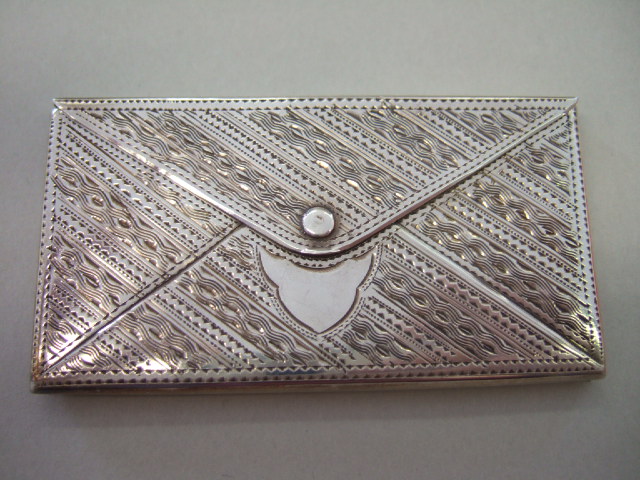 Appraisal: A silver visiting card case designed as an envelope the