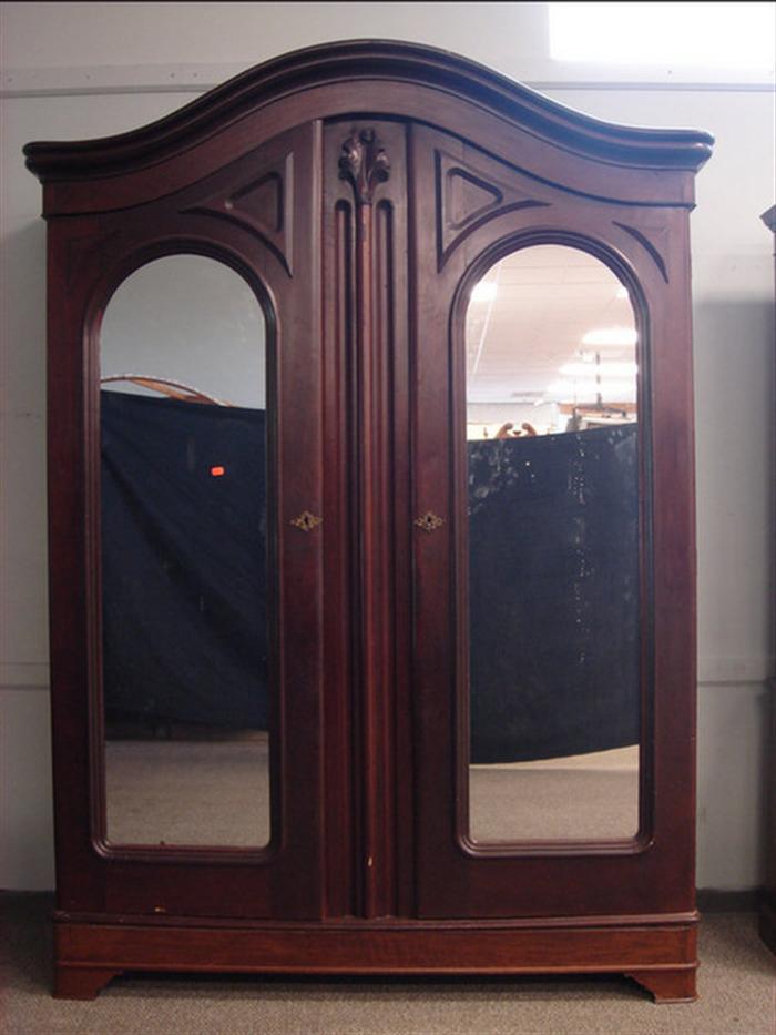 Appraisal: Walnut Victorian double mirrored door wardrobe interior fitted with drawer