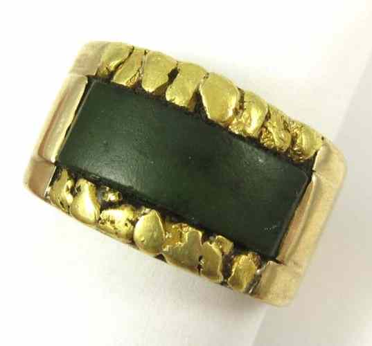 Appraisal: MAN'S JADE AND TEN KARAT GOLD RING The heavy band