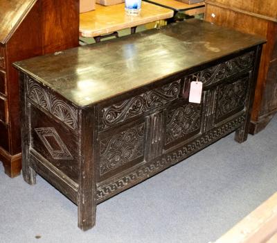 Appraisal: An th Century carved oak coffer with plain hinged cover