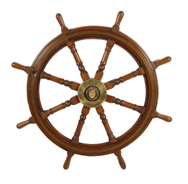 Appraisal: A teak and brass mounted ship s wheel