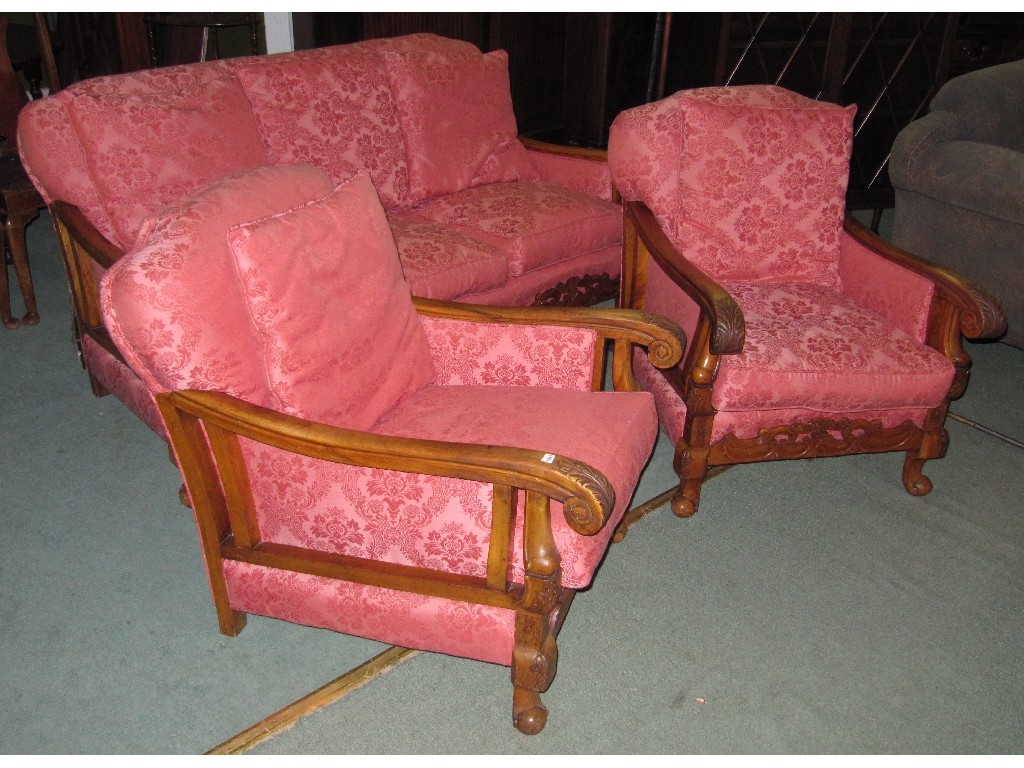 Appraisal: Walnut framed settee with a pair of matching armchairs upholstered