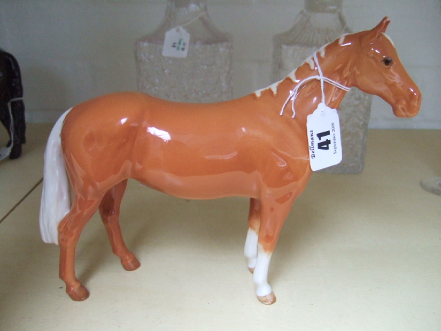 Appraisal: A Beswick horse Huntsman palomino colouring