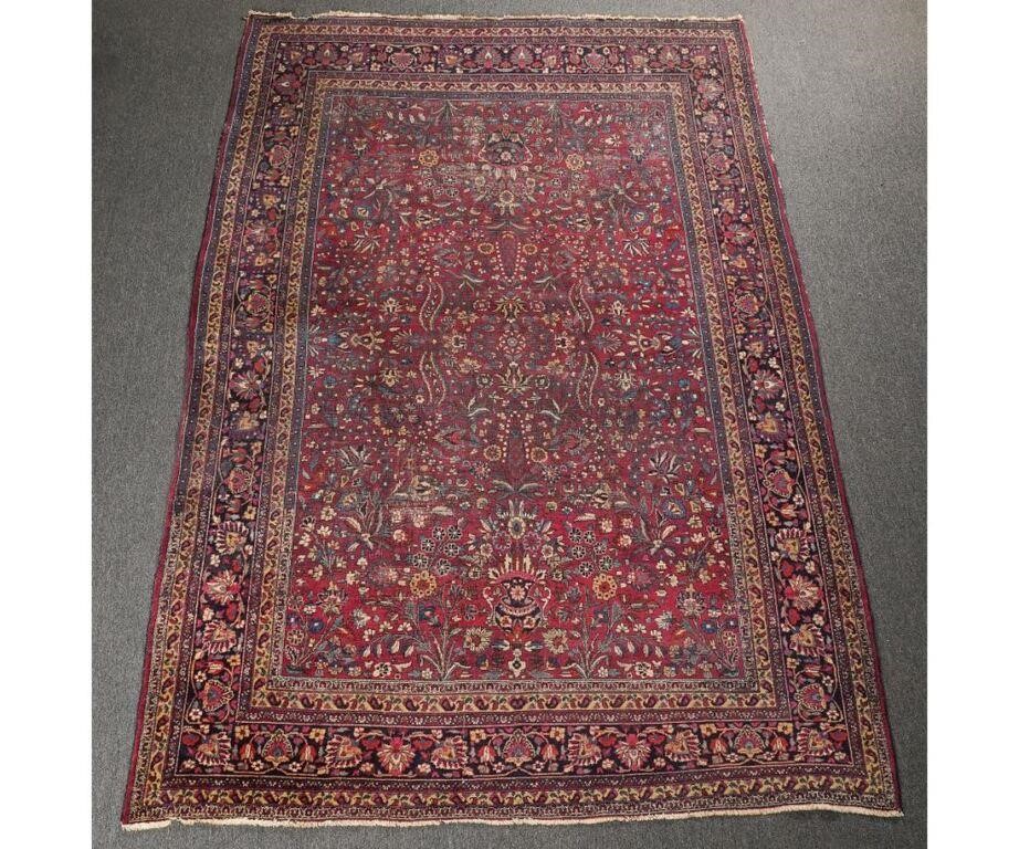 Appraisal: Room size Sarouk carpet with red field and floral patterns