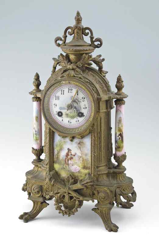 Appraisal: FRENCH CAST METAL AND PORCELAIN MANTLE CLOCK Cast metal case