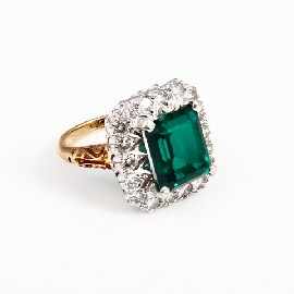 Appraisal: An ct gold green stone and eighteen diamond set cluster