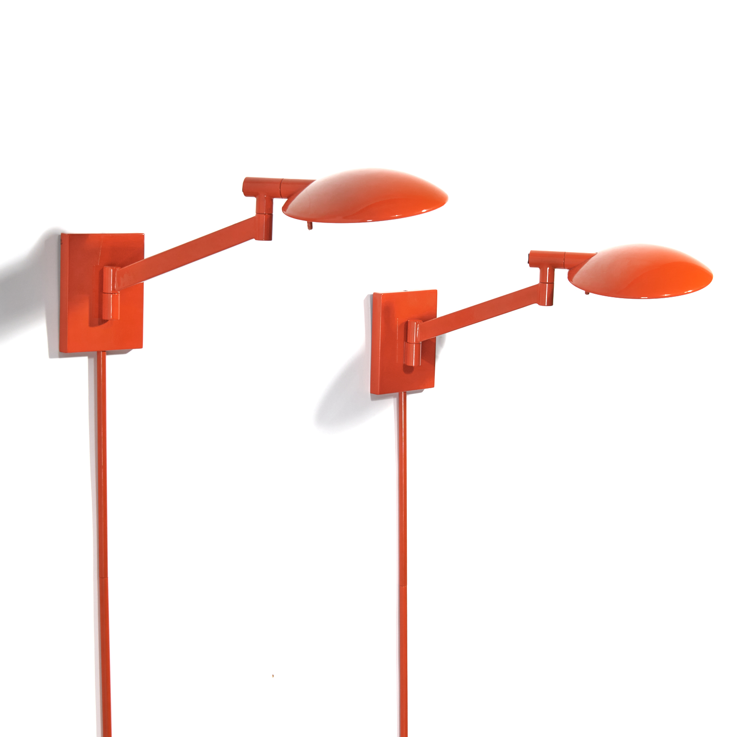 Appraisal: PAIR CONTEMPORARY ORANGE ENAMEL SWING-ARM SCONCES st c good quality