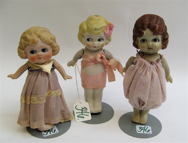 Appraisal: THREE MINIATURE BISQUE GOOGLY EYED GIRL DOLLS all bisque sideway