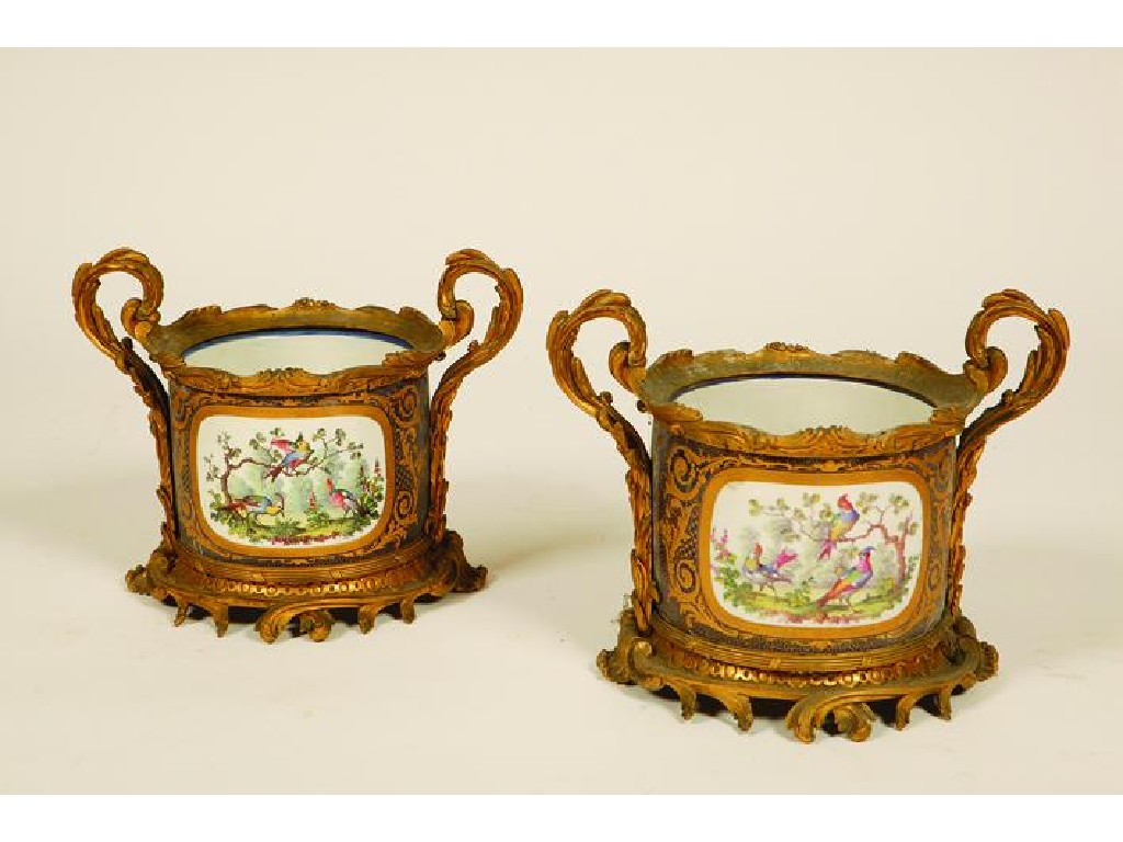 Appraisal: A PAIR OF SEVRES CACHE-POTS with ormolu mounts each with