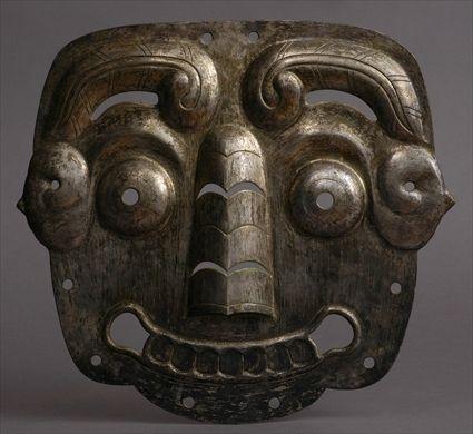 Appraisal: ARCHAISTIC SILVERED METAL TAO TIEH MASK APPLIQUE The smiling face