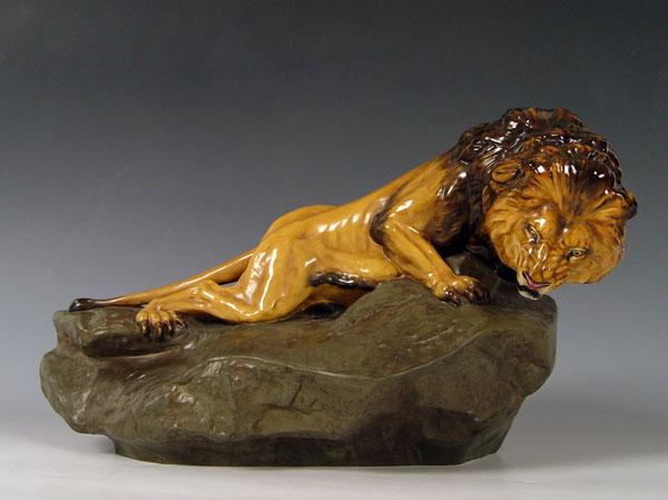 Appraisal: LARGE ROYAL DOULTON LION ON ROCK HN Designed and signed