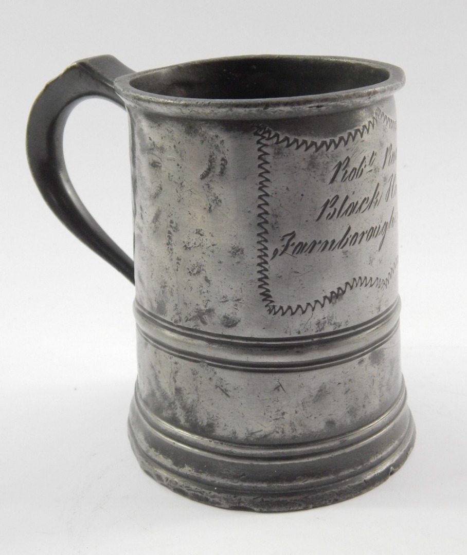 Appraisal: A Victorian pewter tankard quart measure with horizontal banding reserve