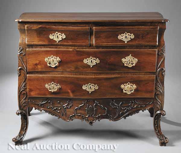 Appraisal: An Iberian Rococo Carved Walnut Bomb Commode in the Iberian