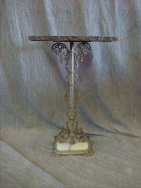 Appraisal: Art Deco marbletop metal end table Dimensions wide x deep