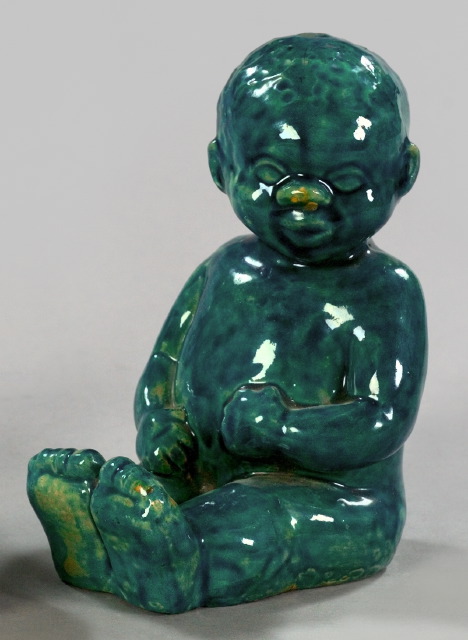 Appraisal: Gloss Teal-Glazed Pottery Figure of a Chubby Black Baby h