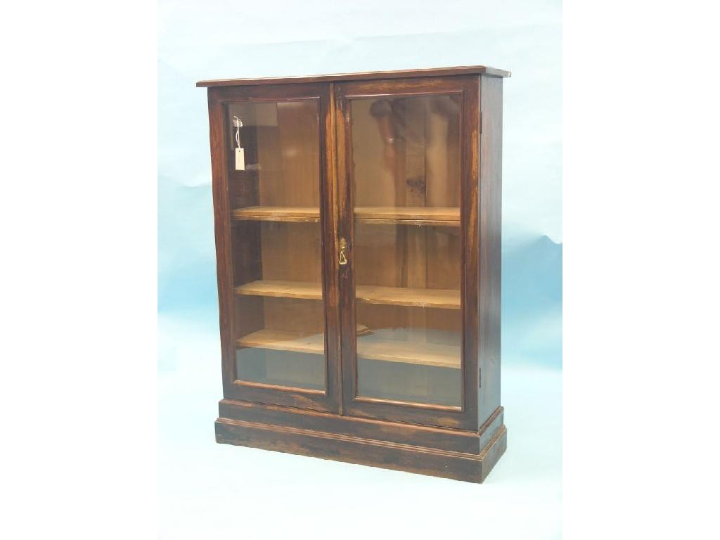 Appraisal: A Victorian walnut bookcase pair of glazed doors enclosing four