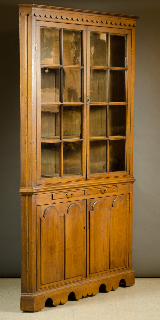 Appraisal: WALNUT CORNER CUPBOARD American th century the top section featuring