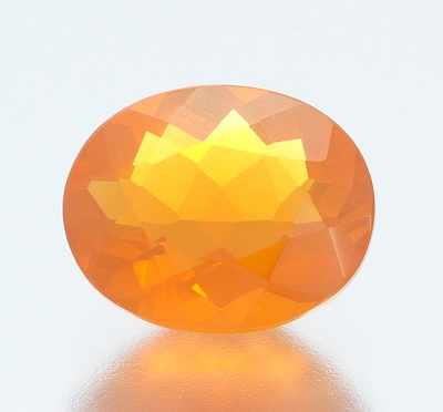 Appraisal: An Unmounted Carat Fire Opal Oval faceted cut fire opal